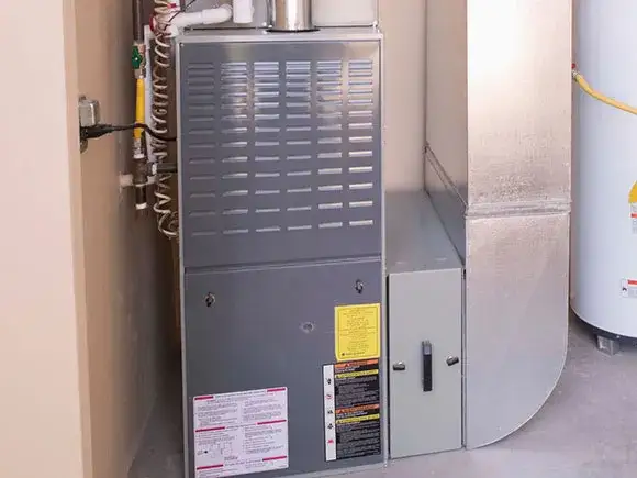 A contractor is standing near the HVAC system testing to see if it is working properly
