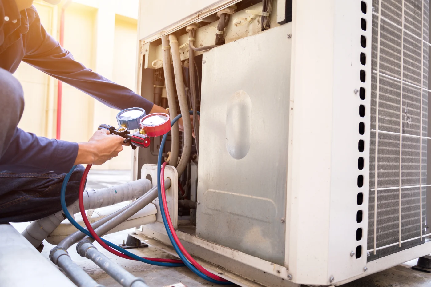 Technician inspecting A/C unit
