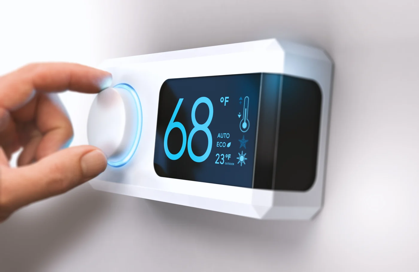 Hand adjusting thermostat on Oakdale, MN wall