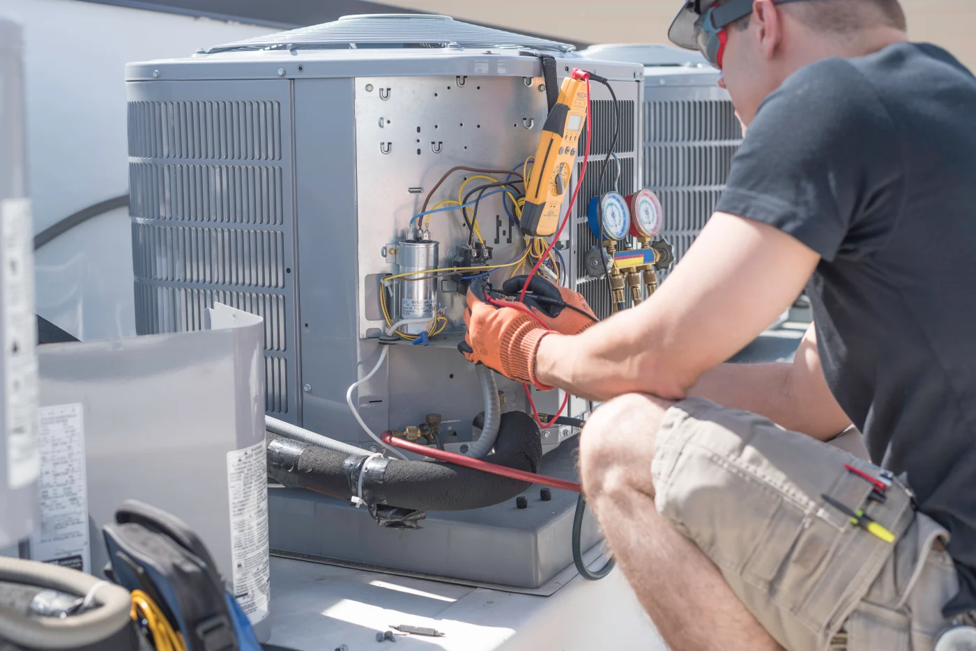 A/C tech working on an air conditioner