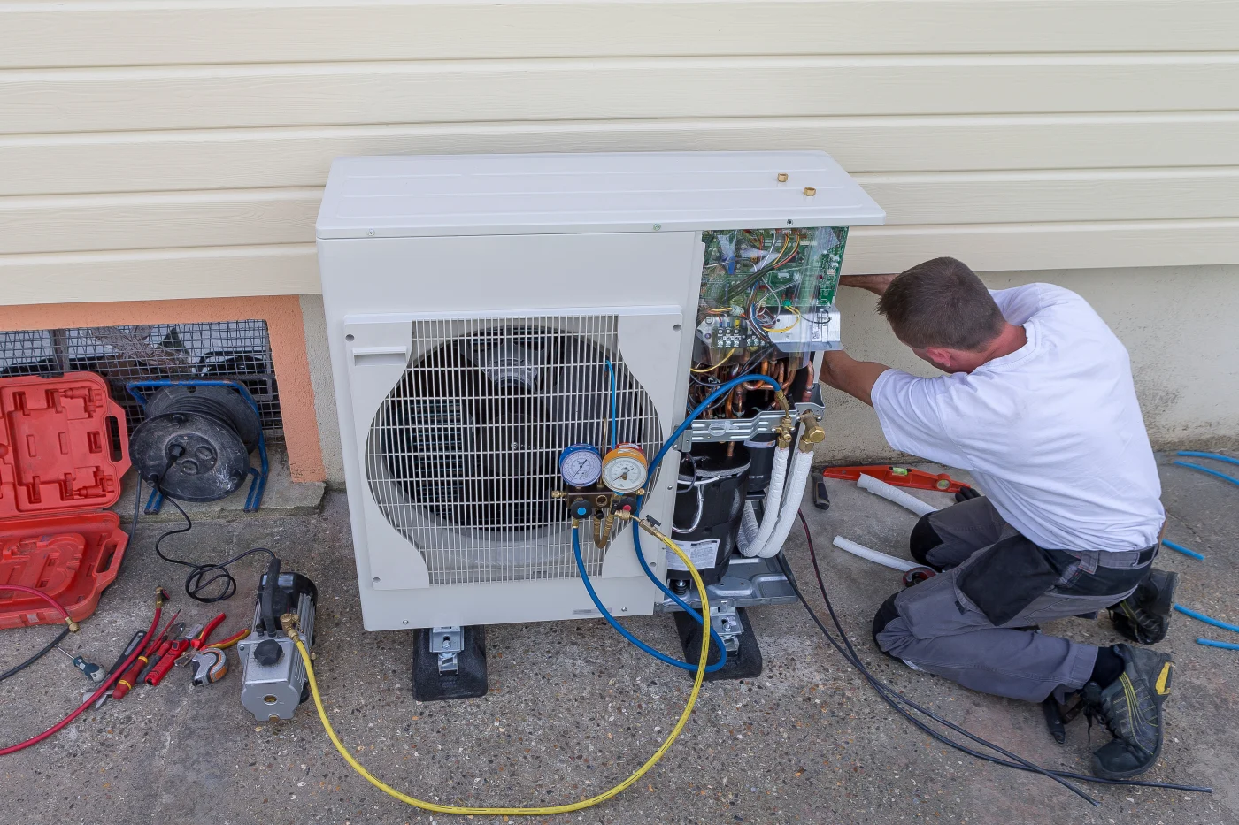 A technician installing heat pump for Oakdale, MN home