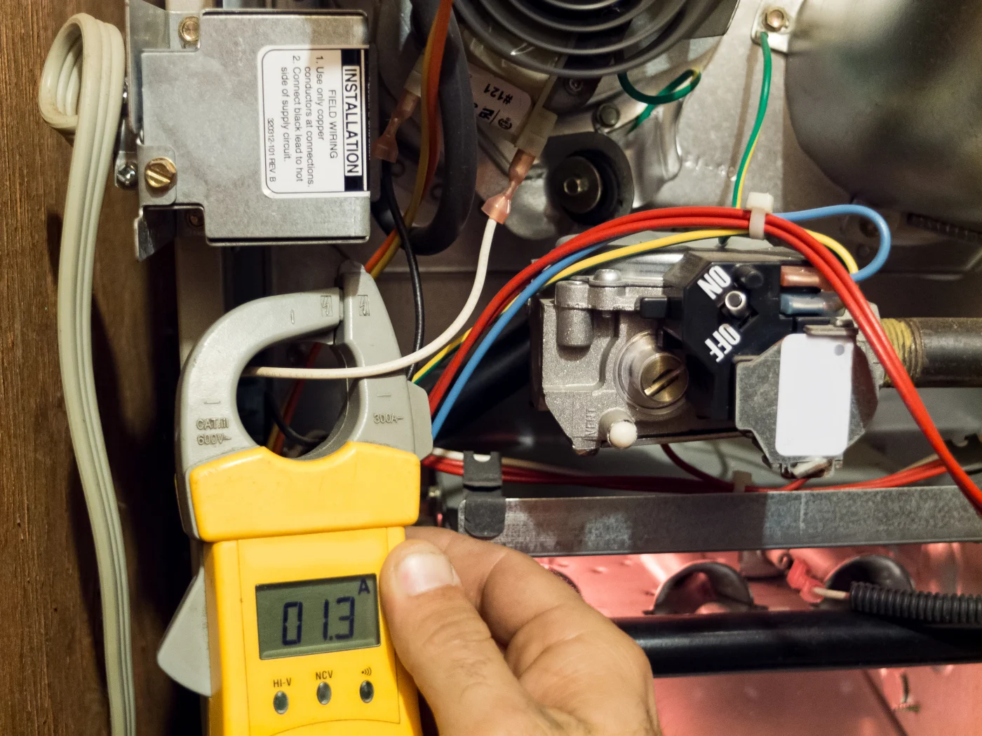 Repairman fixing a furnace