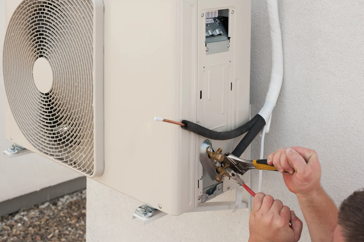 HVAC tech installing a new air conditioner