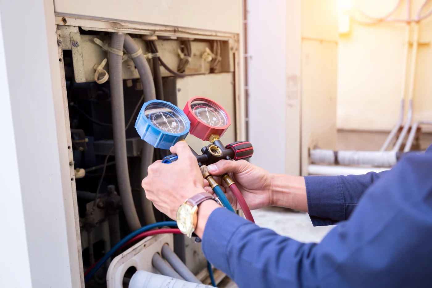 A/C technician inspecting A/C unit