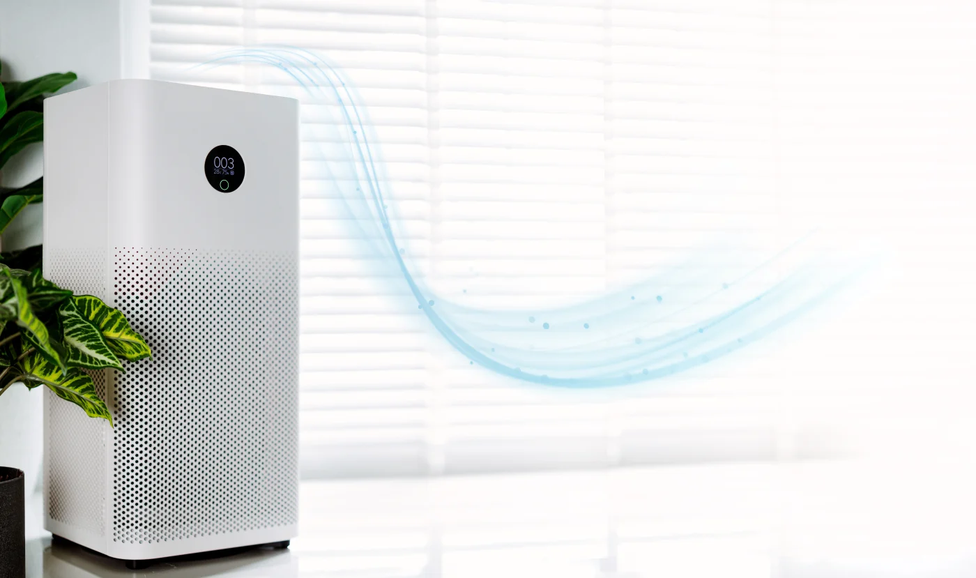 A home purifier is shown with airflow going throughout the room and house