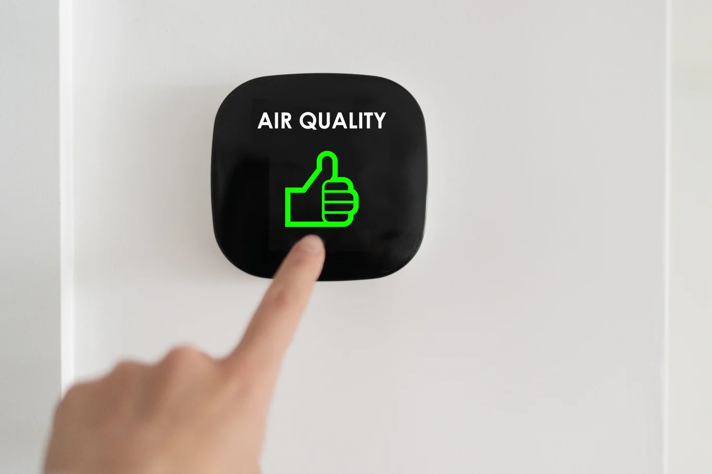 A person pushes a button for air quality.