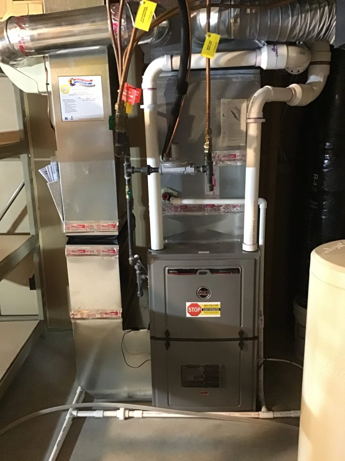 High-efficiency gas furnace system in a Lakeland, MN home, showing new ductwork, PVC venting, and connected piping after professional furnace service.