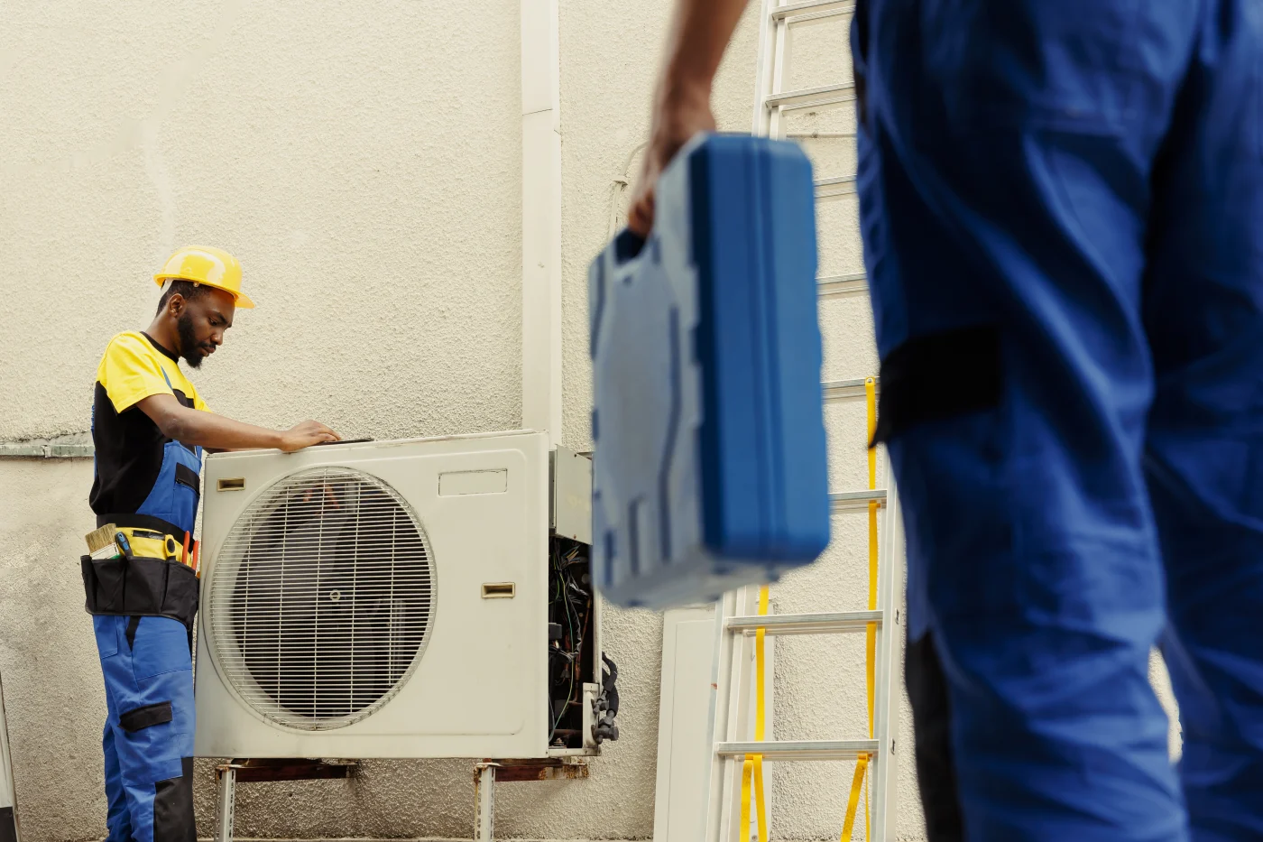 Professional Expert AC Replacement In Cottage Grove, MN Professional technicians installing an AC unit